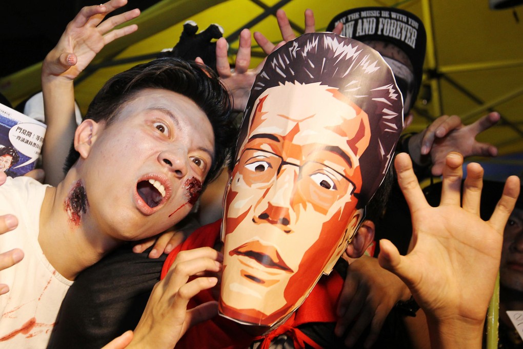HKTV supporters get into the Halloween spirit as they protest outside government headquarters. Photo: Nora Tam