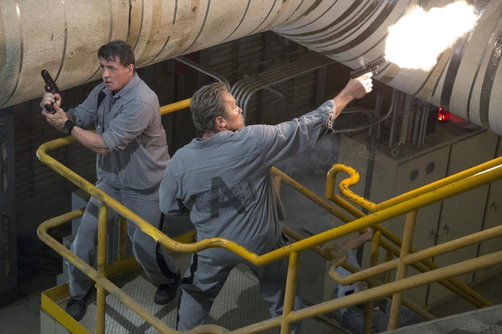Sylvester Stallone (left) and Arnold Schwarzenegger blaze their way out of a tight spot in Escape Plan. Photo: Alan Markfield