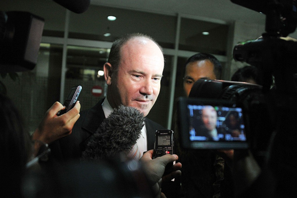 Australian Ambassador Greg Moriarty is surrounded by journalists upon his arrival at the Indonesian foreign ministry on Friday, following reports that Australian embassies were being secretly used to intercept phone calls and data across Asia as part of a US-led global spying network. Photo: AFP