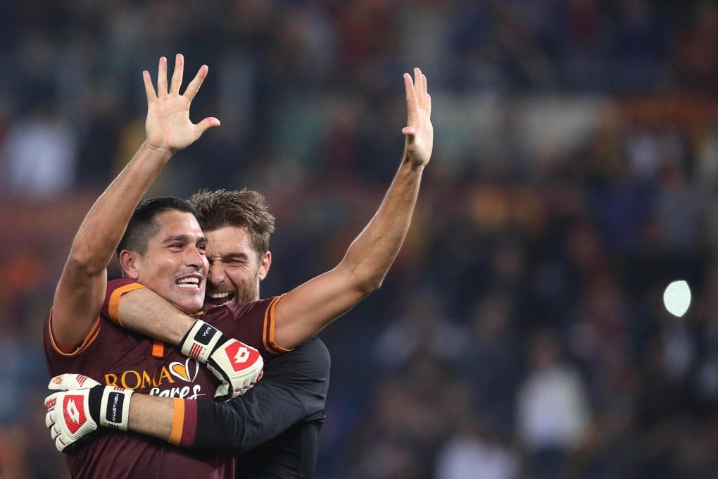 Marco Borriello (left) and Morgan de Sanctis celebrate at the end of the match. Photo: EPA