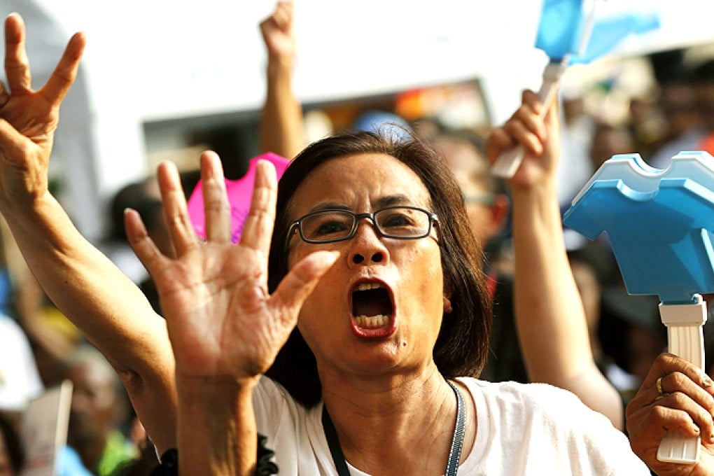 Supporters of opposition Democrat Party shout slogans during a rally against an amnesty bill in Bangkok, Thailand, on Thursday. Photo: EPA