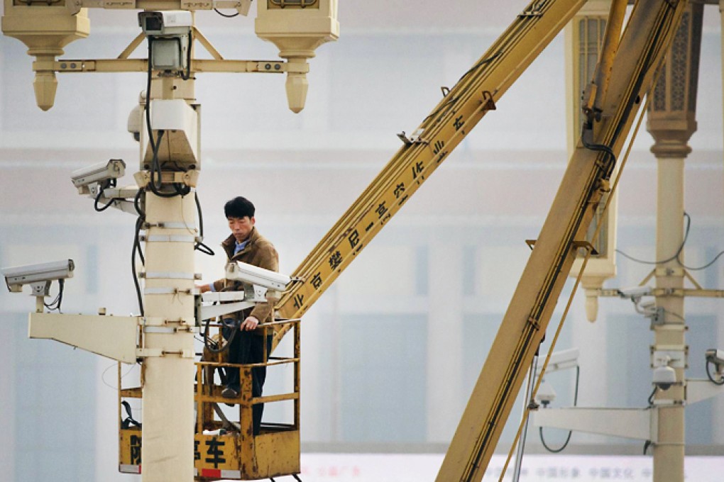 A worker checks on security cameras at Tiananmen Square in Beijing yesterday in the aftermath of Monday's terrorist attack. Photo: AFP