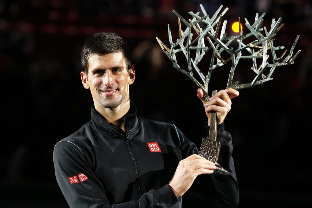 Novak Djokovic holds his trophy after winning the Paris Masters title. Photo: Reuters