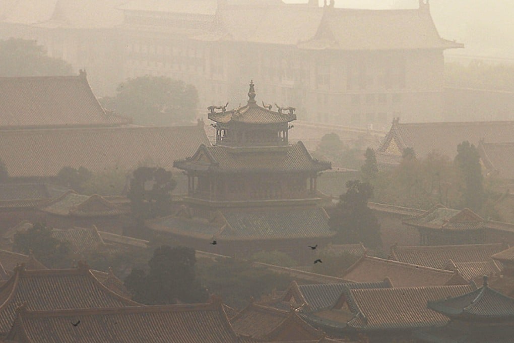 Pigeons fly over Forbidden City in Beijing. Photo: Simon Song