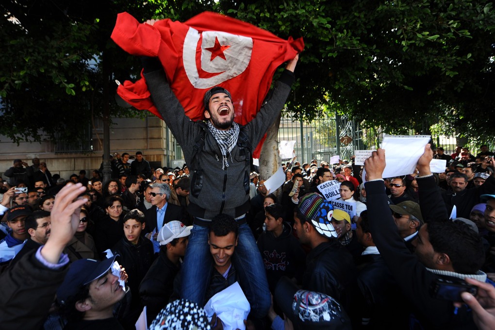 Tunisians protest outside the gates to the French embassy in Tunis over remarks made by the then French ambassador Boris Boillon in February 19, 2011. Photo: AFP