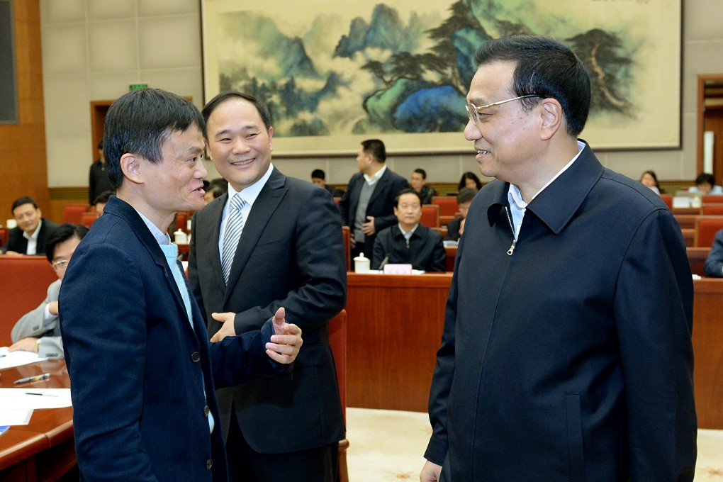 Premier Li Keqiang (right) talks with Ma Yun (left) and Li Shufu during a meeting to discuss China's economic development. Photo: Xinhua