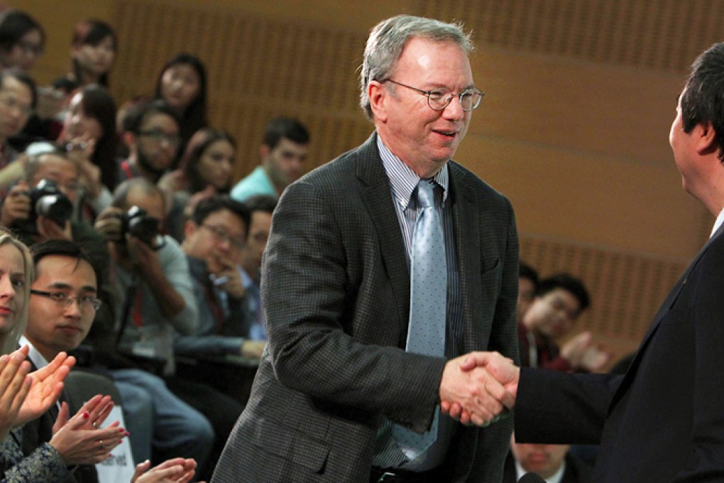 Google chairman Eric Schmidt receives a warm welcome at Chinese University yesterday. He wants to encourage more young entrepreneurs. Photo: Felix Wong