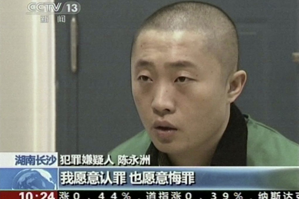 Chinese journalist Chen Yongzhou is shown confessing on state television. Photo: AP