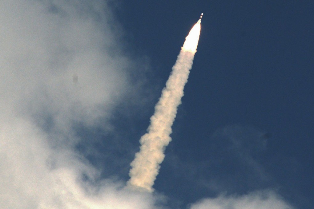 India's Mars Orbiter Mission Spacecraft blasts off into orbit yesterday, completing the first stage of an 11-month journey that could see New Delhi win Asia's race to the red planet. The cut-price Mars mission, at only HK$562 million, comes five years after India sent the lowest-cost mission to the moon. Photo: EPA