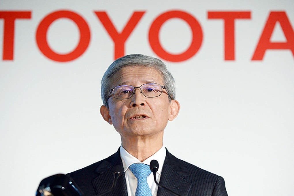 Toyota vice president Nobuyori Kodaira announces the second quarter financial results during a press conference in Tokyo on Wednesday. Photo: AFP