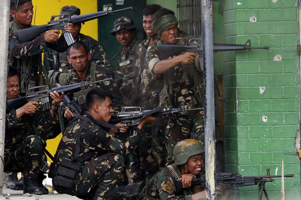 Filipino army soldiers engage Muslim rebels. Photo: EPA