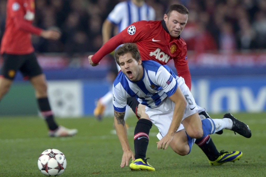 Wayne Rooney tackles Real Sociedad's Inigo Martinez in the 0-0 Champions League draw in San Sebastian. Photo: Reuters