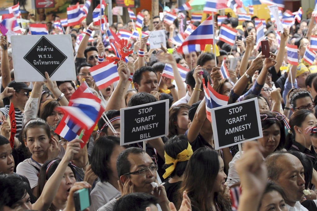 Thai workers at an anti-amnesty bill demonstration in Bangkok on Wednesday. Photo: AP