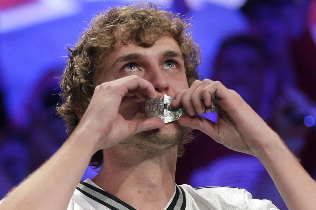 Ryan Riess kisses the championship bracelet after defeating Jay Farber in the World Series of Poker in Las Vegas. Photo: AP