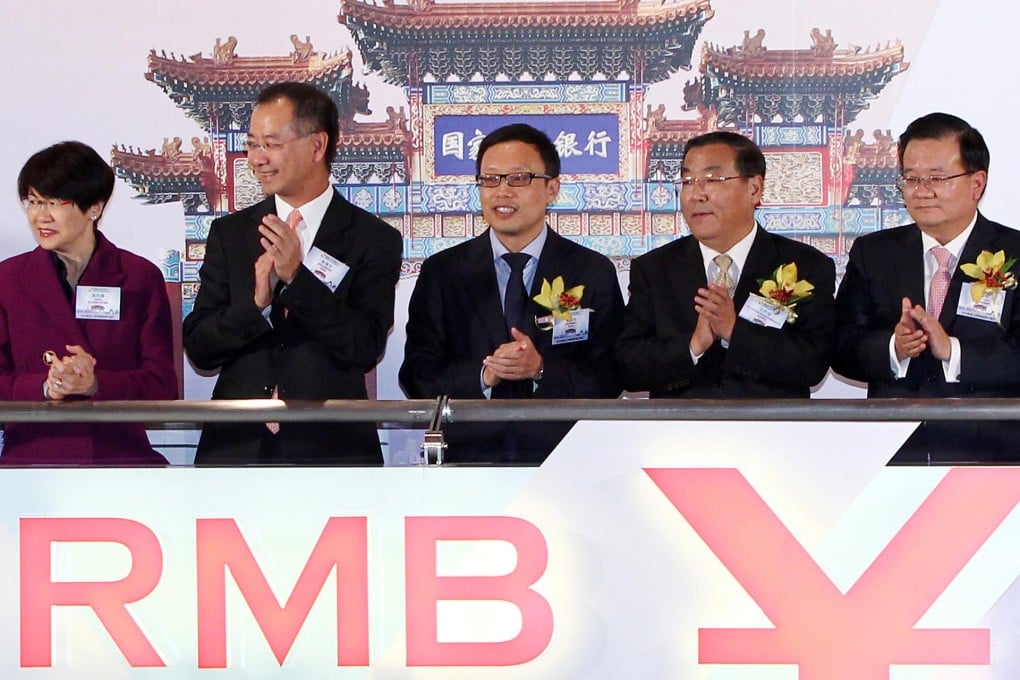 Hong Kong and mainland officials at the launch of China Development Bank's issuance of offshore yuan bonds yesterday. Photo: Edmond So
