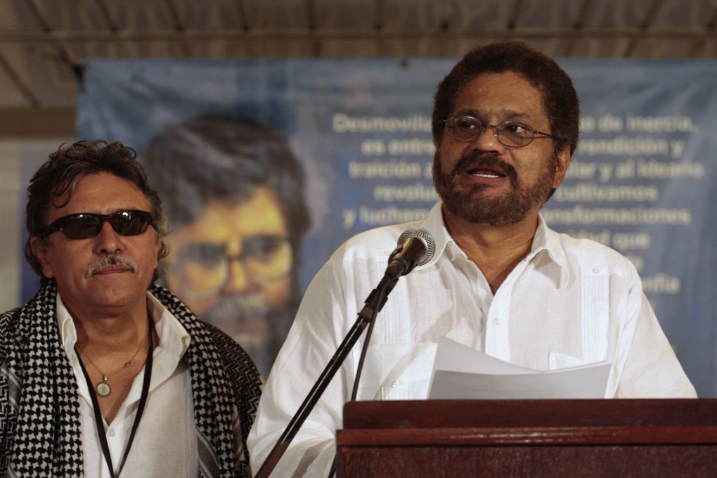 Colombia's Farc lead negotiator Ivan Marquez (right) speaks to reporters in Havana. Photo: Reuters