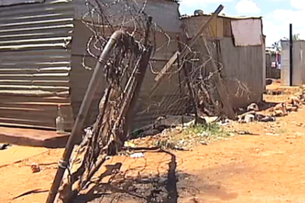 The aftermath of vigilante killings in Khutsong, which involved six people being burned alive or stoned to death. Photos: SCMP