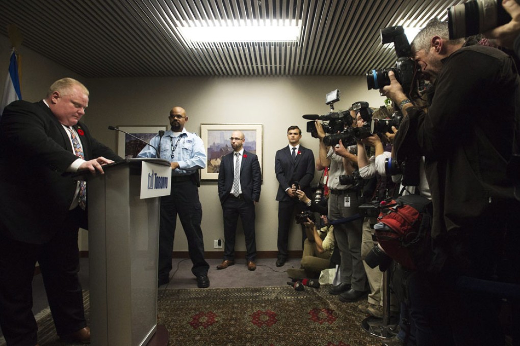 After admitting crack cocaine use, Mayor Rob Ford tells the press it's time " to get back to work". His parting words, "God bless the people of Toronto" drew laughs. Photo: AP
