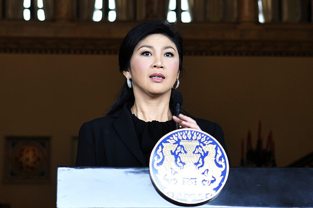 Thai Prime Minister Yingluck Shinawatra speaks during a press conference to issue an urgent plea to stop demonstrations at Government House in Bangkok, Thailand, on Thursday. Photo: Xinhua