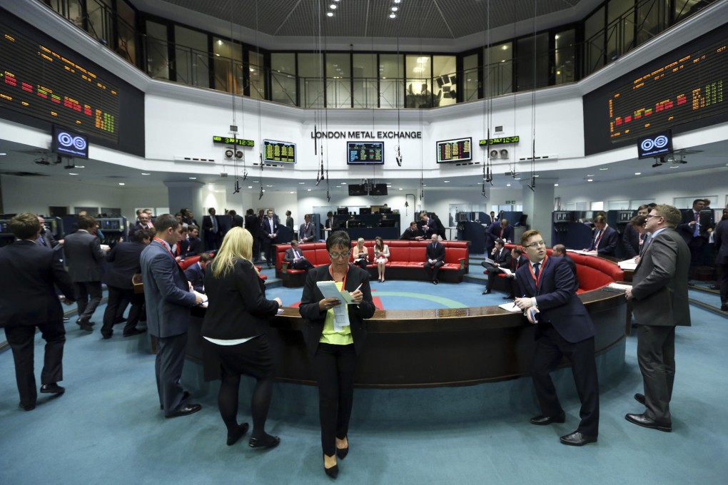 Traders at the open outcry pit of the London Metal Exchange, where reforms are targeting queues of more than 50 days. Photo: Bloomberg