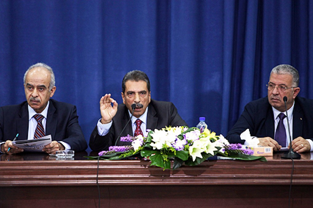 Tawfiq Tirawi (centre), Palestinian inquiry chief into the death of late Palestinian leader Yasser Arafat, speaks at a press conference in Ramallah. Photo: AFP