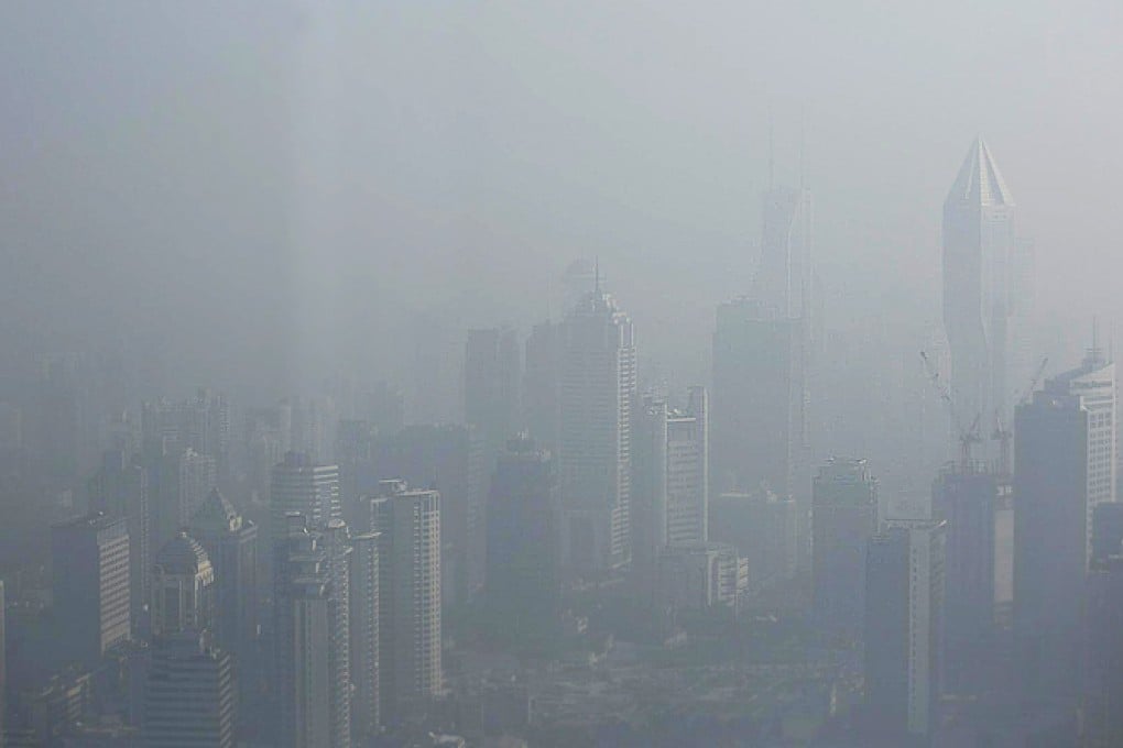 Buildings are barely visible amid heavy smog in downtown Shanghai yesterday. Photo: Reuters