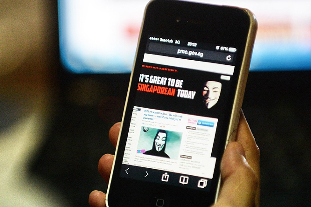 Singapore Prime Minister Lee Hsien Loong's official website was briefly hacked on Thursday, by apparent members of activist group Anonymous after he vowed to hunt down anyone who attacks the city-state's technology network. Photo: AFP