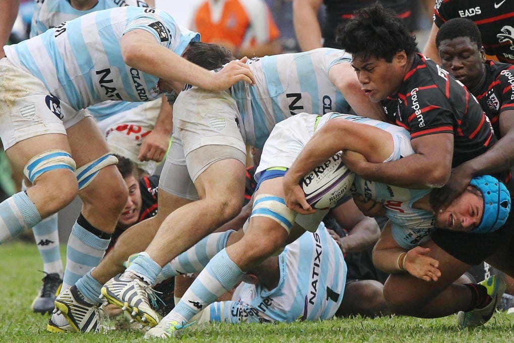 Racing Metro flanker Luc Barba is stopped by Toulouse No 8 Chris Tolofua in the Natixis Cup match at Aberdeen. Photo: Edward Wong