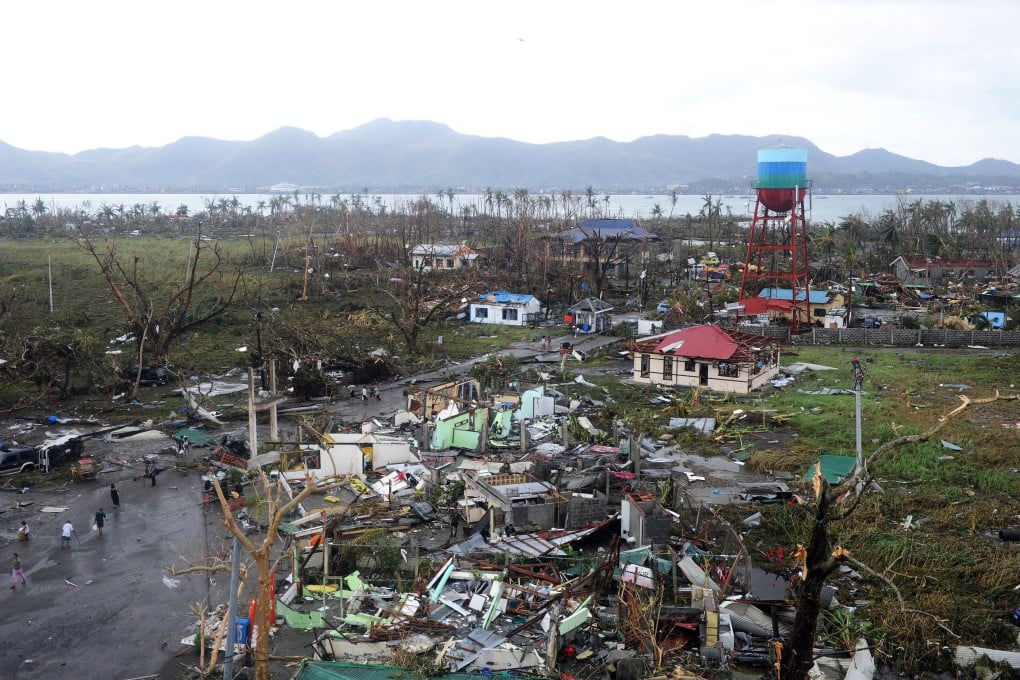 houses destroyed by the strong winds caused by typhoon Haiyan at Tacloban, eastern island of Leyte, Philippines. Photo: AFP