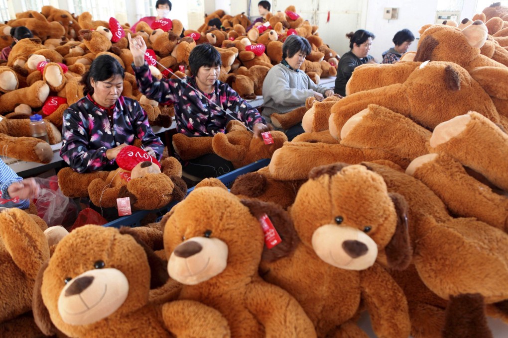 Workers make stuffed animals to be exported to Europe and America at a toy factory in Ganyu county, Zhejiang province. Photo: Reuters