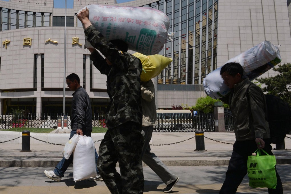 Migrant workers in Beijing. Many seek the benefits that residency in the city provides. Photo: AFP