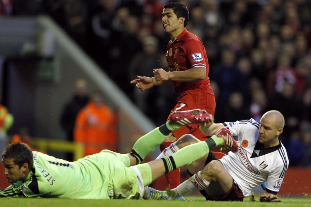 Liverpool's Luis Suarez scores against Fulham. Photo: Reuters