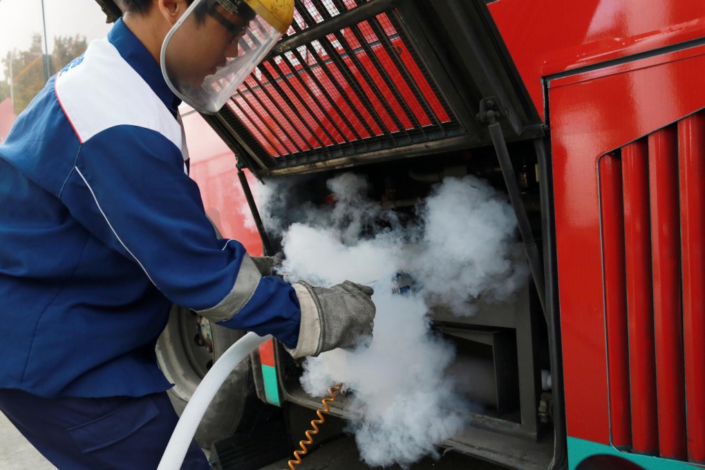 A bus is filled with LNG in Shenzhen. Mainland energy giant CNOOC is backing plans for the fuel's use in Hong Kong. Photo: Cheung Chi-fai