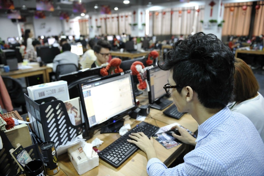 A staff member responds to customers' online questions at the headquarters of a Tmall online shop in Guangzhou ahead of the "Singles' Day" shopping promotion. Photo: Xinhua