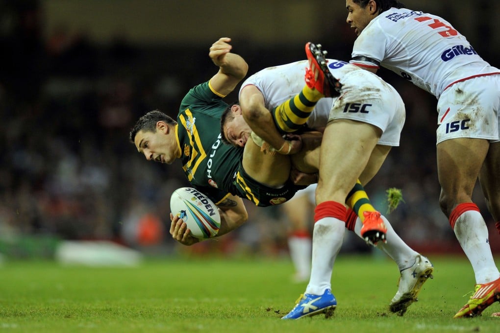 Australia's Billy Slater, seen being upended in their Rugby League World Cup match against England early in the competition, was attacked in a Manchester nightclub. Photo: AFP