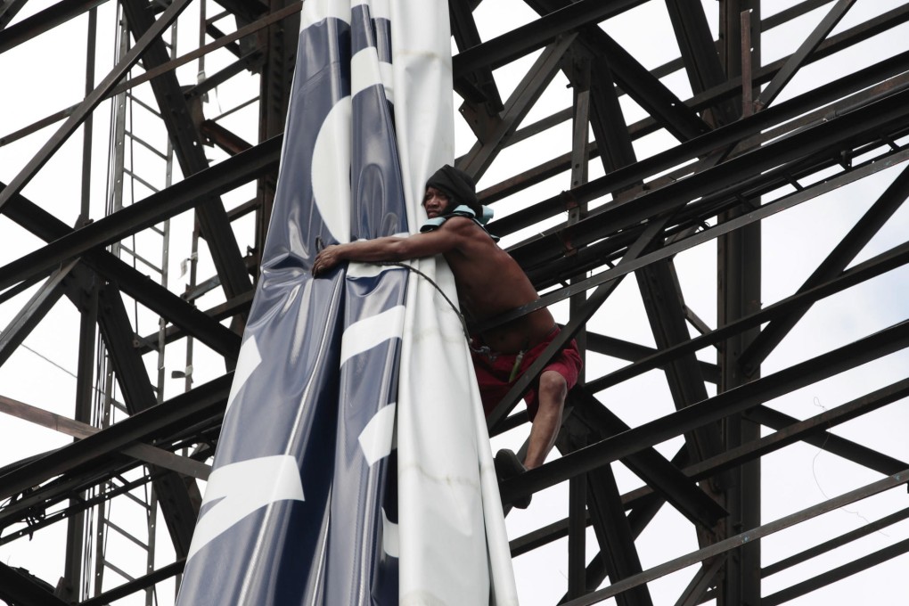 Billboards are vulnerable to strong winds. Photo: AP