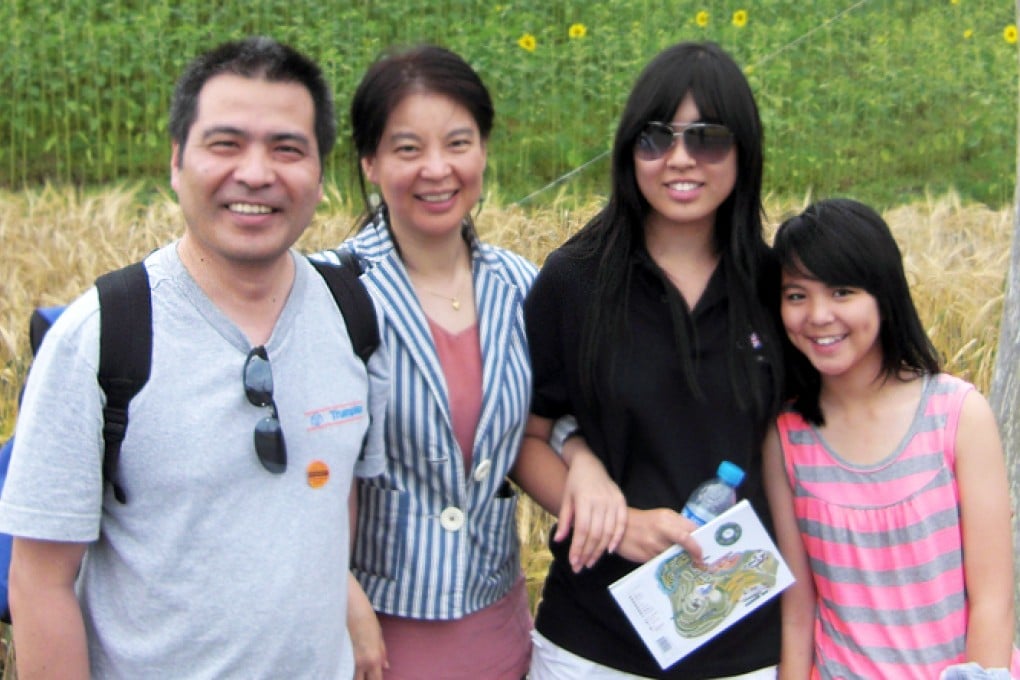 University lecturer Jifeng “Jeff” Ding, his wife Ge “Helen” Chui, and their two daughters, 18-year-old Xing “Nancy” and Alice, 12. Photo: SCMP Pictures; Eugene Henderson