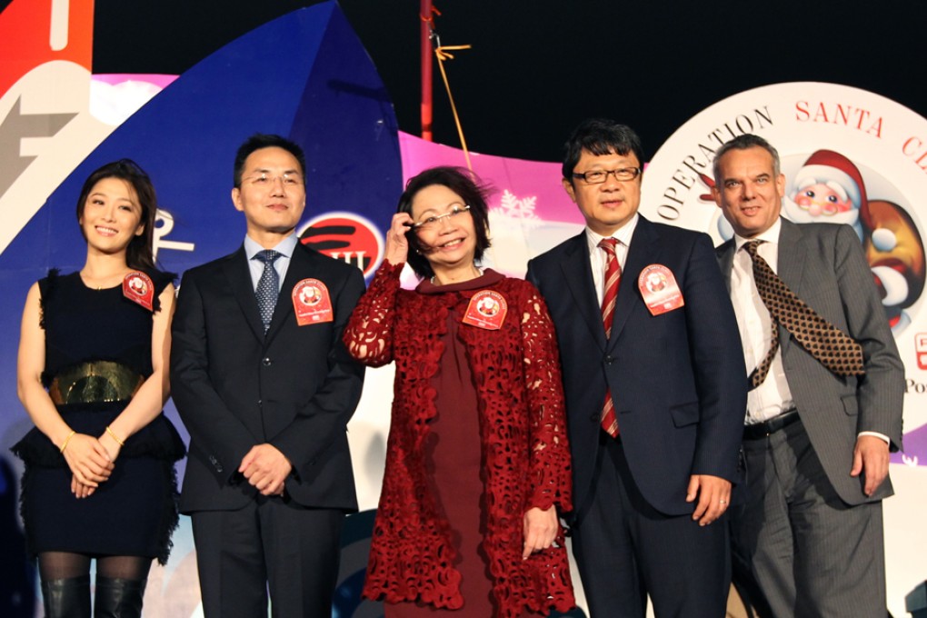 Operation Santa Claus Ambassador, Niki Chow Lai-kei; Director of Broadcasting Roy Tang Yun-kwong; Mrs Regina Leung Tong Ching-yee, wife of Chief Executive ; CEO of SCMP Robin Hu and Director of Hong Kong Maritime Museum Richard Wesley attend "Operation Santa Claus 2013 " kick-off ceremony.