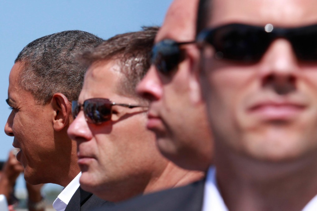 Secret Service agents stand guard for President Barack Obama as new allegations involving two agents further damage their elite reputation. Photo: AFP