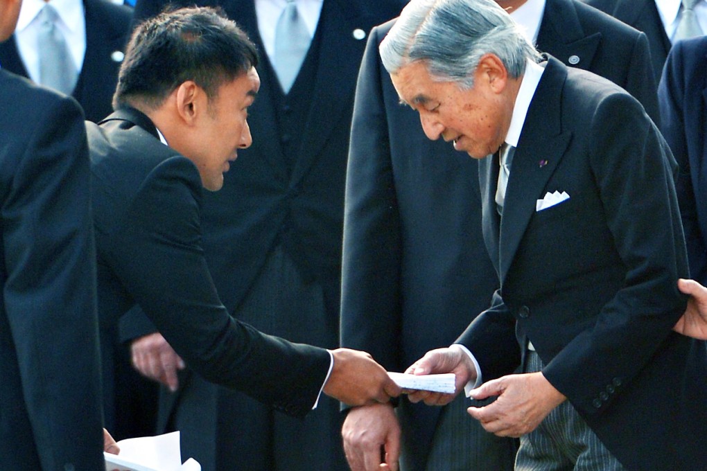 Japanese lawmaker Taro Yamamoto (second left) caused an uproar in Japan when he handed a letter to the emperor. Photo: AP