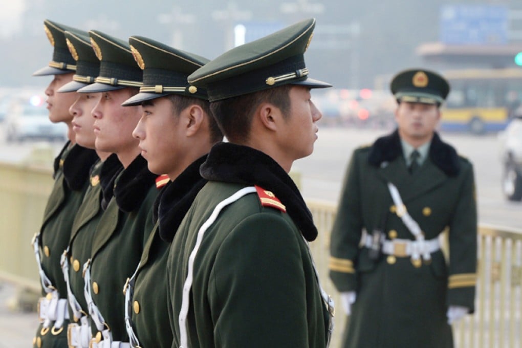 Chinese para-military police stand guard in Tiananmen Square on November 8, 2013. Photo: AFP