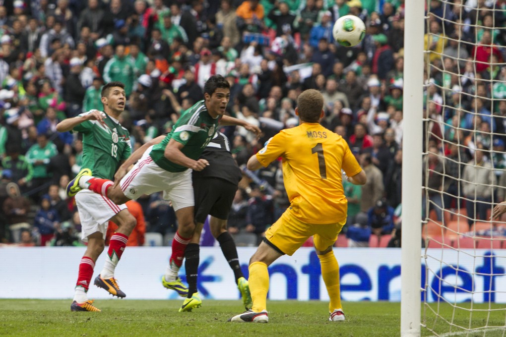 Mexico's Raul Jimenez heads home his side's second goal  against New Zealand at the Azteca. Photo: Xinhua