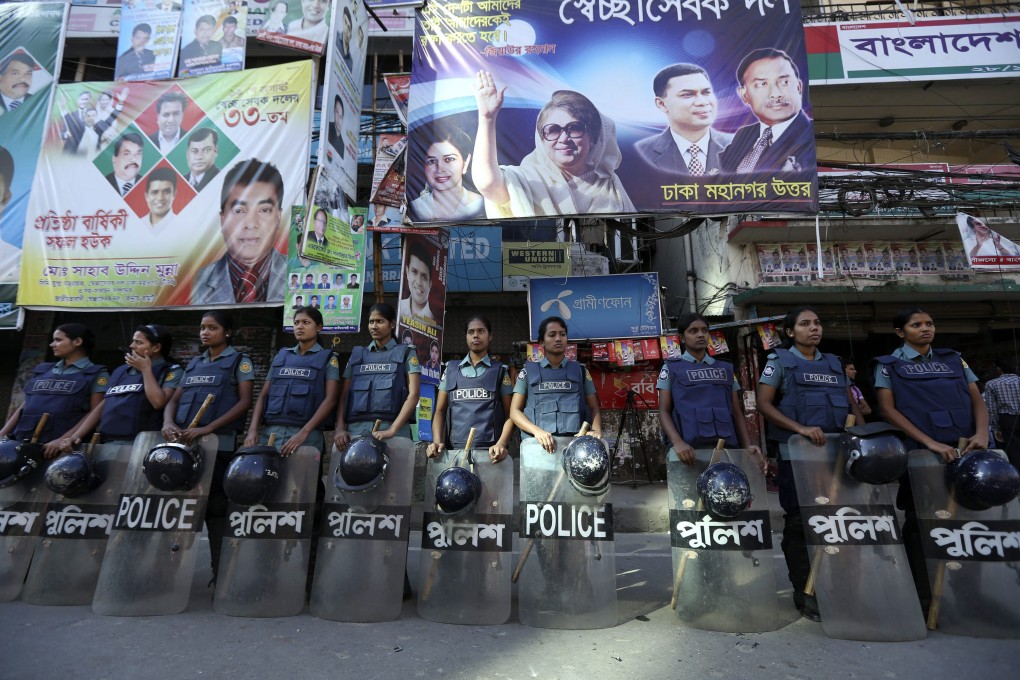 Female police officers stand guard on the first day of a country-wide strike in Dhaka. Photo: EPA