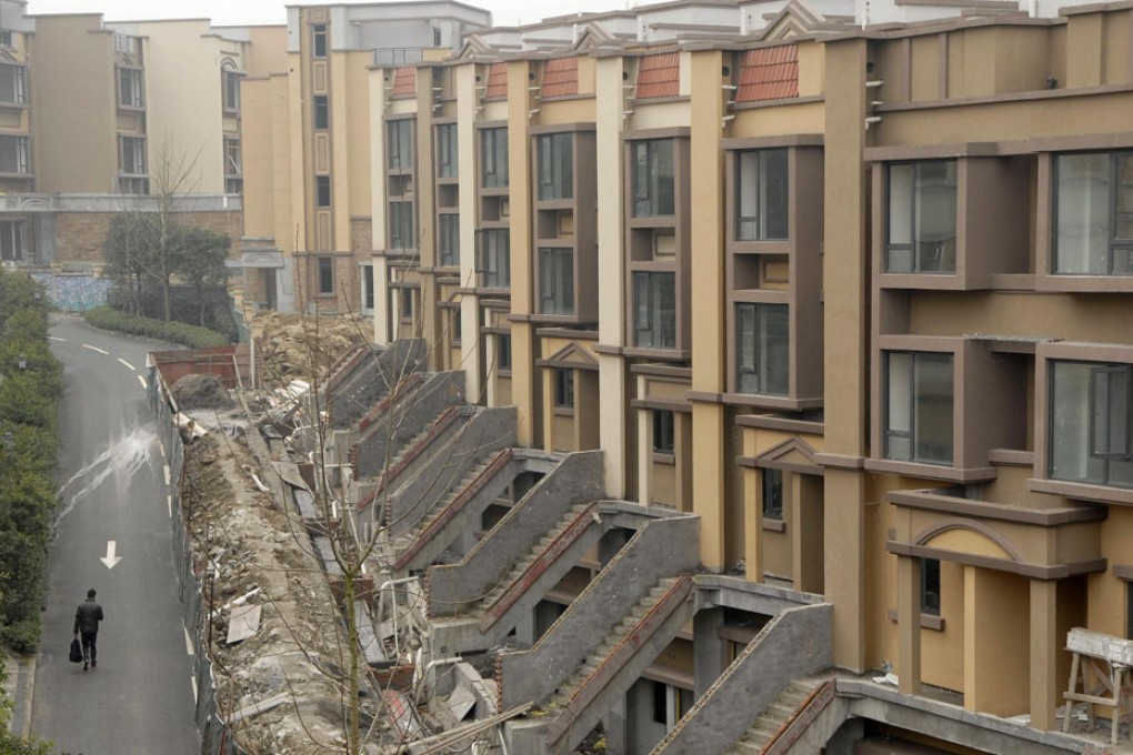 China began levying a property tax in Shanghai and Chongqing in 2011. Photo: Reuters
