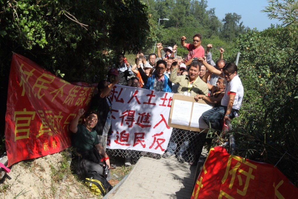 Sai Wan villagers protest against the governments plans for the country park, blocking the Oxfam Trailwalker route. Photo: K.Y. Cheng