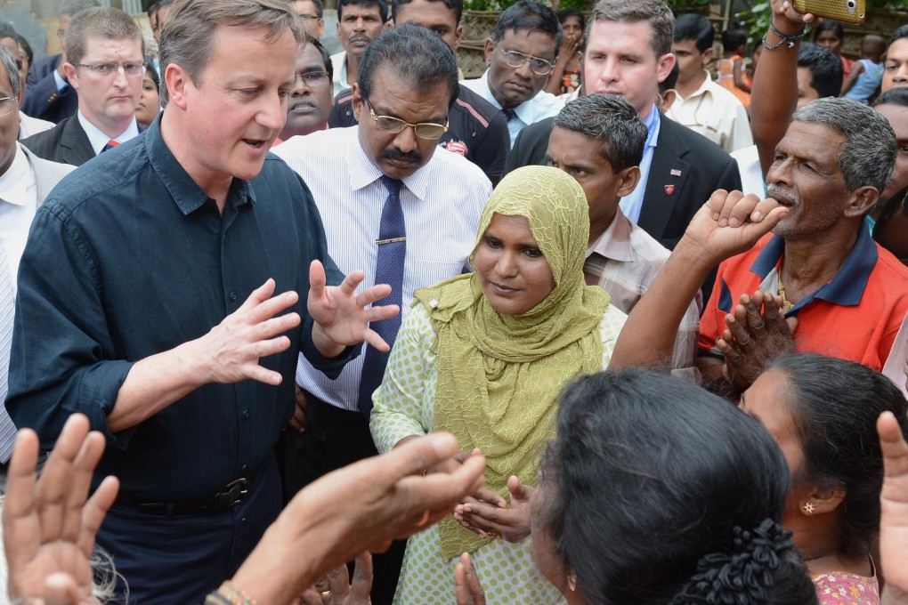 David Cameron meets Jaffna residents during a visit to the former Tamil Tiger stronghold. Photo: AFP