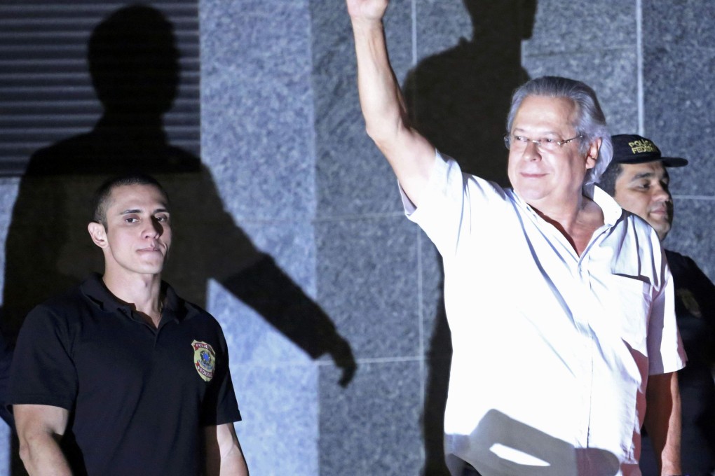 Jose Dirceu (right), chief-of-staff under Brazil's former president Inacio Lula da Silva, turns himself in to police. Photo: Reuters