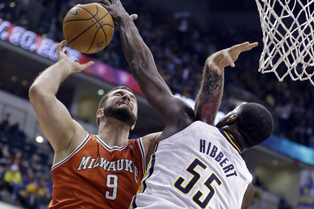 Indiana Pacers center Roy Hibbert blocks the shot of Milwaukee Bucks centre Miroslav Raduljica during the first half of an NBA game in Indianapolis. Photo: AP