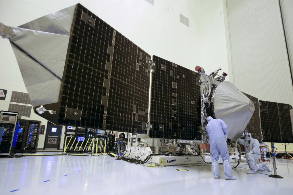 Nasa technicians work on Maven. Photo: AP