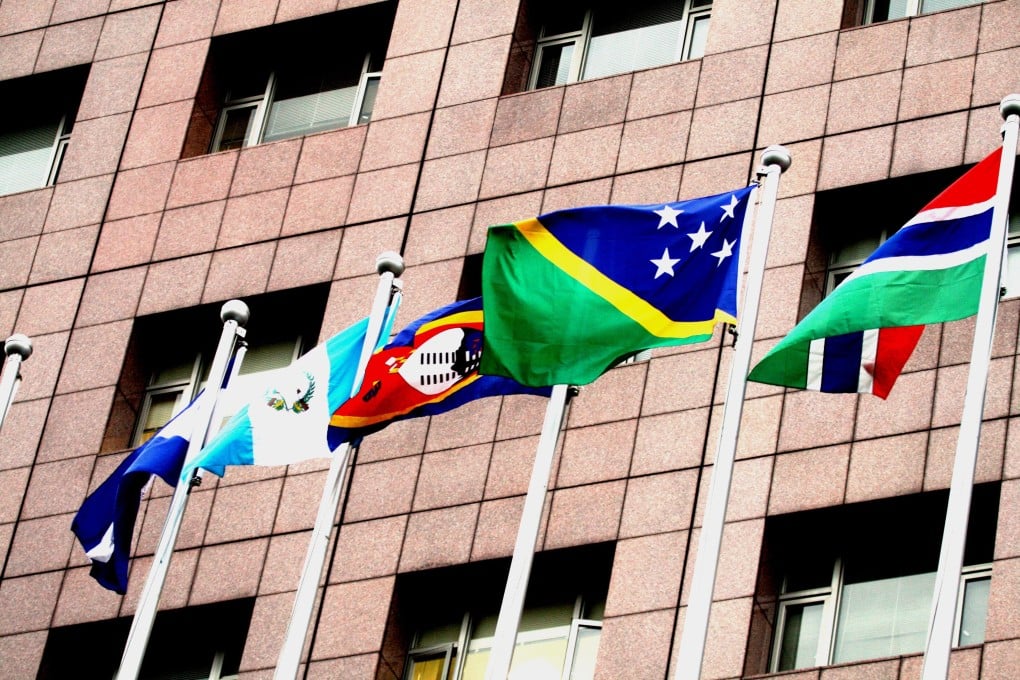 Gambia's red-blue-green national flag (right) flying outside the Diplomatic Quarter building in Taipei, Taiwan. Photo: EPA